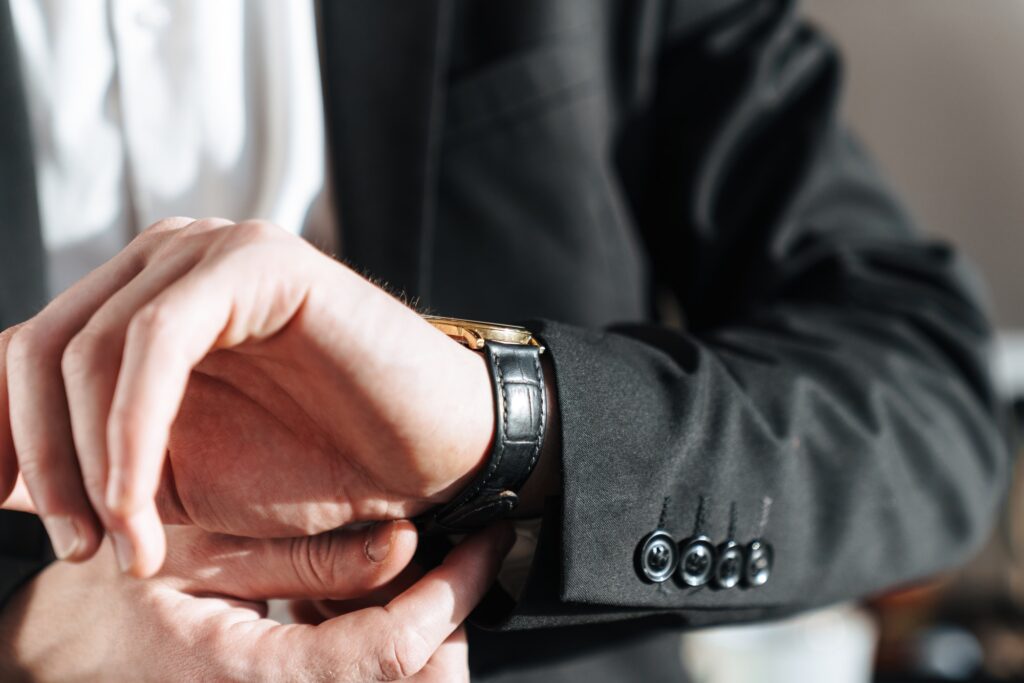 cropped-photo-of-businessman-wearing-wristwatch-and-black-suit.jpg